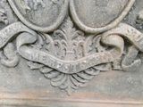 a close up of a stone sculpture with a bird on it