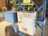 a small machine that is sitting in a warehouse