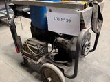 a small machine that is sitting in a warehouse