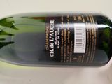 a bottle of wine that is sitting on a table