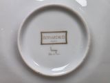 a white plate with a brown label on it