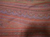 an image of a close up of a paisley pattern on a blanket