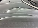 a close up of a car ' s paint job on the hood