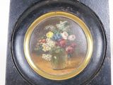a picture of a picture of a vase of flowers on a plate