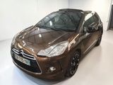 a brown citrole is parked in a white room