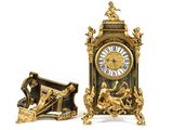 two clocks that are sitting side by side on a white surface