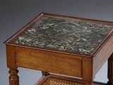 a small table with a marble top on a wooden stand