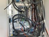 a bunch of wires and wires on the wall