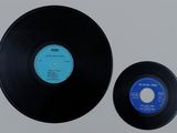 an image of a black vinyl record with a blue label on it