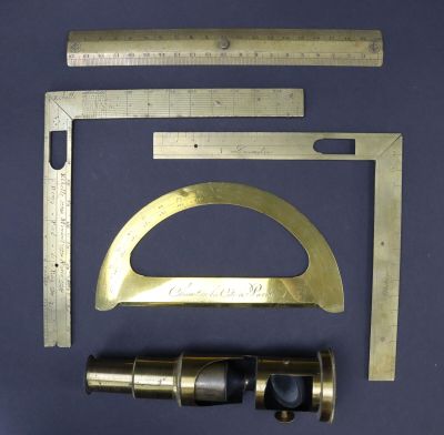 an image of a set of tools that include a ruler, a measuring scale, and a caliper