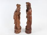 pair of chinese carved wood figures of a man and a woman