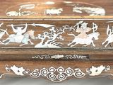 a wooden box that has a design on it