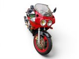 a red motorcycle that is parked on a white surface