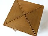 a small wooden box with a triangle inside of it