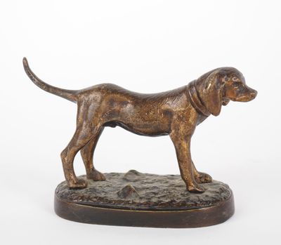 bronze statue of a dog standing on a base on a white background