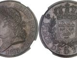 a close up of a coin with a crown on top of it