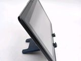 a tablet that is sitting on a stand on the table