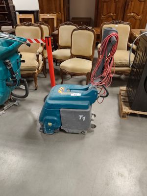 many chairs and a machine in a room