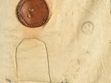 a close up of a piece of cloth with a button on it