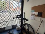 an image of a gym room with equipment and a window