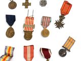 several medals and medals are arranged in a circle on a white surface