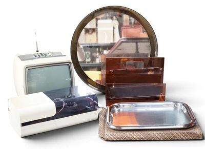 a lot of items that include a tv, a mirror, and a tray