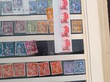 a picture of a collection of stamps on display in a book