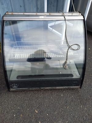 a glass display case with a mouse inside of it
