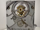 a box with a clock inside of it on a table