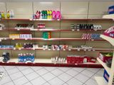 many shelves in the store that have various products on them