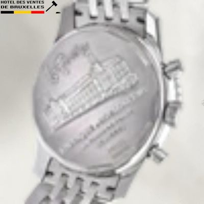 a close up of a watch on a white surface