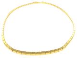 a close up of a gold necklace on a white background