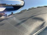 a reflection of a truck in the side mirror of a car