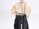 an image of a doll with a sword on a white background
