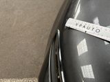 a close up of a sticker on the hood of a car