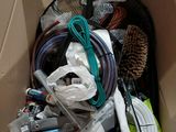 a cardboard box with a bunch of wires and other items in it