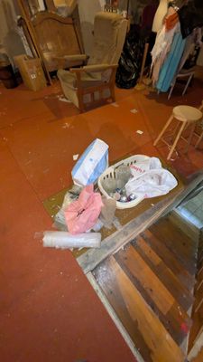 an image of a messy room with a lot of stuff on the floor