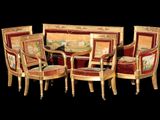a group of chairs and a table in a room