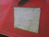 a red truck with a white sign on the side of it