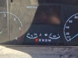 a close up of a car dashboard with a speedometer