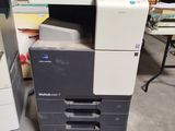 a printer that is sitting on the floor next to a printer