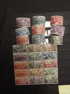 a lot of different stamps on display on the wall