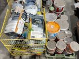 a cart full of cans and cans of paint on the ground