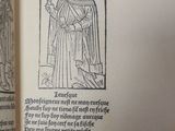 an open book with a drawing of a man holding a sword