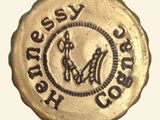 a gold coin with a picture of a horse on it