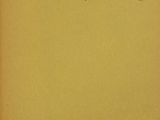 a yellow book with black writing on the cover of it
