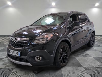 a picture of a black buick suv parked in a garage