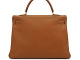 a brown leather handbag on a white background