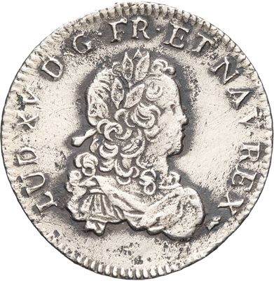 gros plan d'une pièce de monnaie sur fond blanc