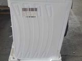 an image of a white refrigerator sitting on top of a pallet in a warehouse
